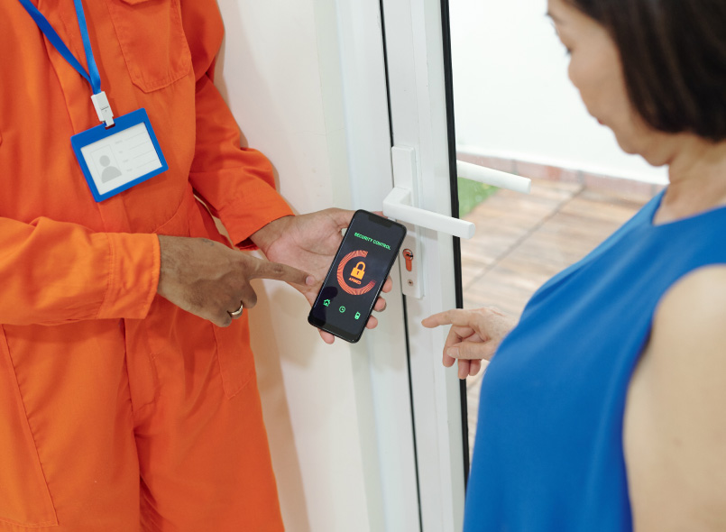 an image of a person showing a staff member how to use access control at work