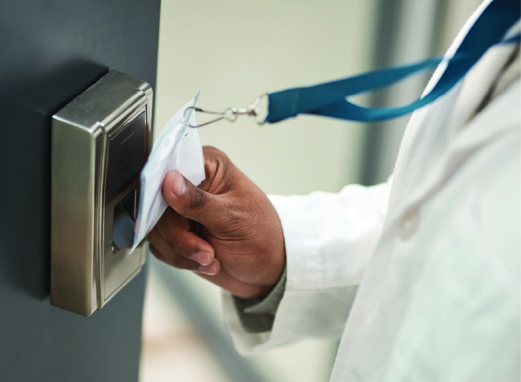 staff scanning access control ID to open a door